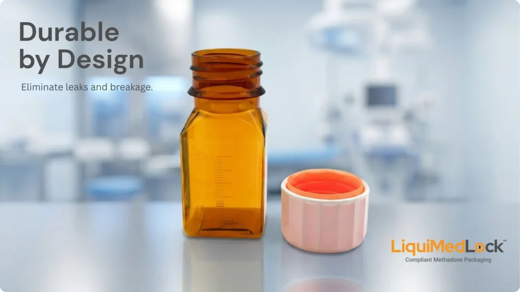An open, square amber LiquiMedLock bottle resting on a counter next to its white and orange two-piece cap, set against a blurred clinic background. The image features the text "Durable by Design. Eliminate leaks and breakage." alongside the LiquiMedLock logo.